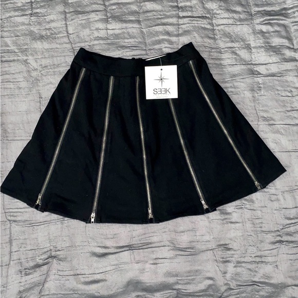 LF Dresses & Skirts - Sold at LF, SEEK The Label, black shirt with 5 silver zippers on the front. New!